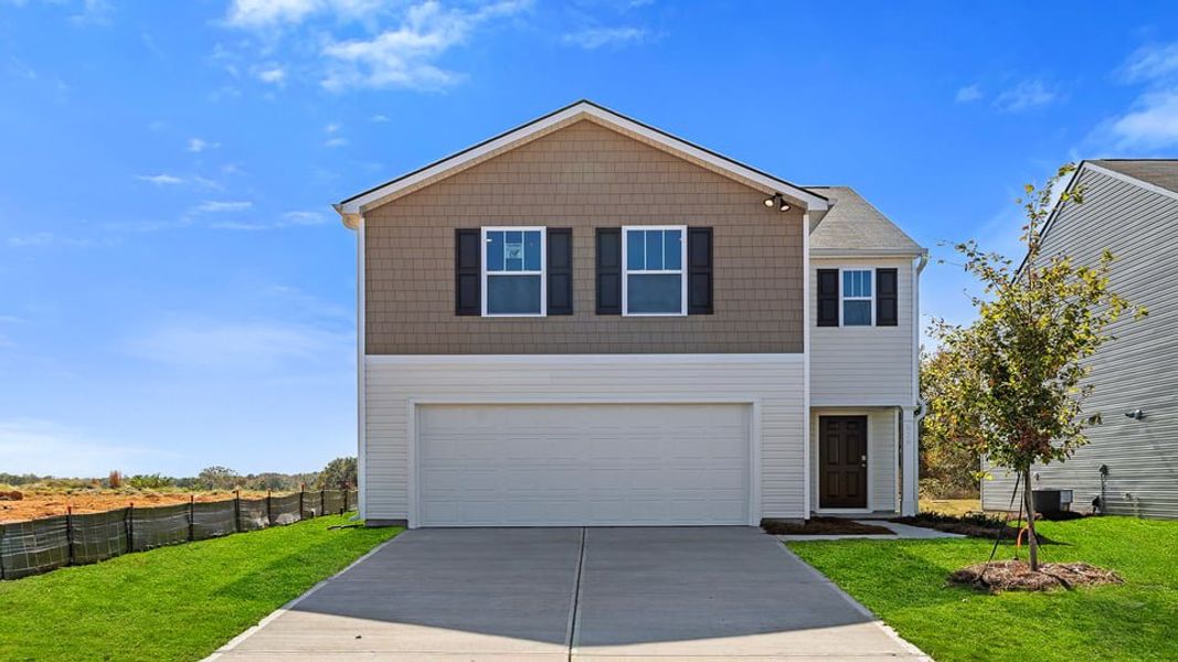 Front exterior of a new home in Durbin Meadows, Fountain Inn, SC, highlighting curb appeal (Image 1). Front exterior of a new home in Durbin Meadows, Fountain Inn, SC, highlighting curb appeal (Image 1).