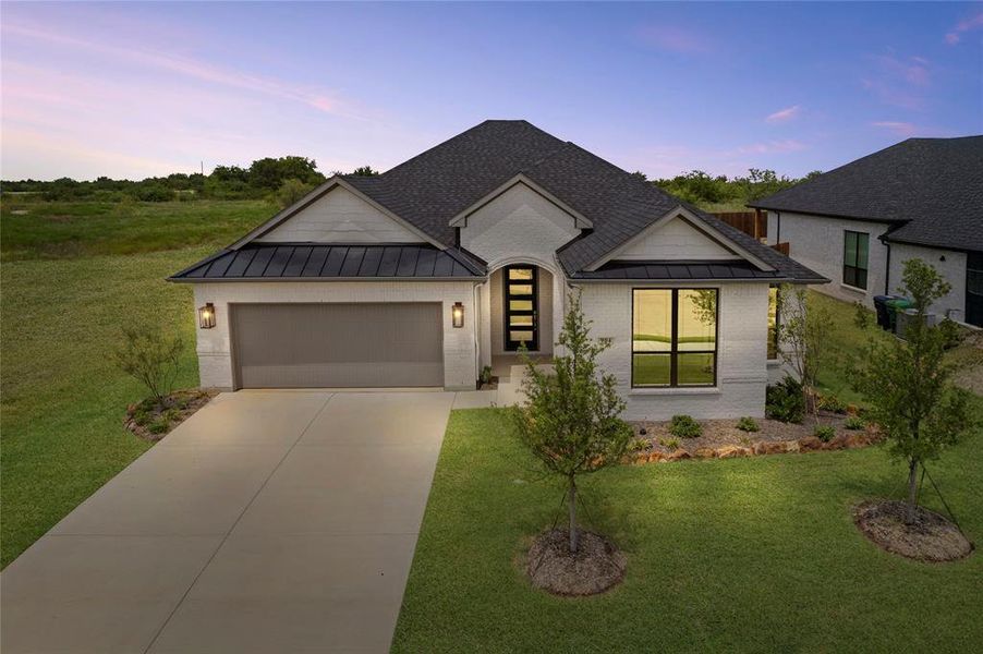 Front exterior of a new home in University Park at Northpointe, Denton, TX, highlighting curb appeal (Image 2). Front exterior of a new home in University Park at Northpointe, Denton, TX, highlighting curb appeal (Image 2).