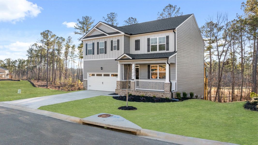 Front exterior of a new home in Southwind Village, Evans, GA, highlighting curb appeal (Image 24).