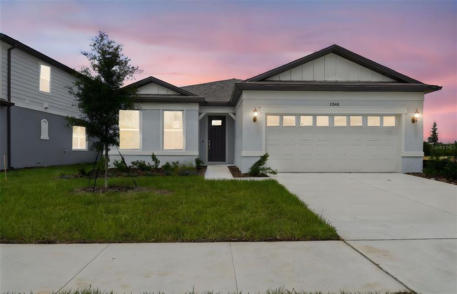 Front exterior of a new home in Silverlake, Lake Alfred, FL, highlighting curb appeal (Image 1). Front exterior of a new home in Silverlake, Lake Alfred, FL, highlighting curb appeal (Image 1).