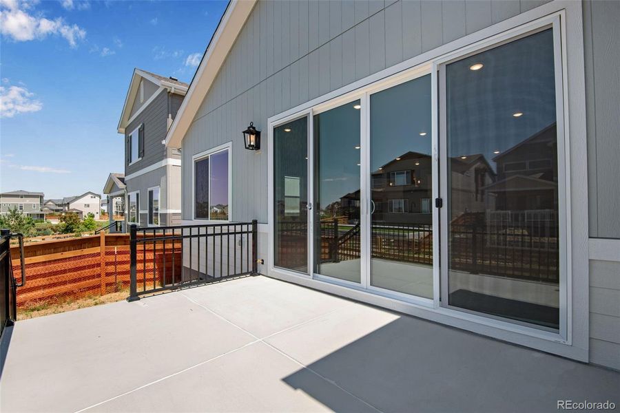 Exterior details and patio area of a home in Reunion Ridge, Commerce City (Image 28).