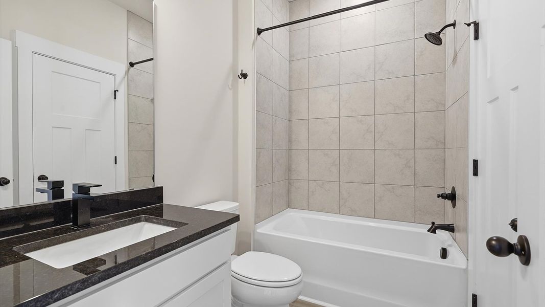 Vibrant and welcoming bathroom with elegant countertop space and polished details located in Woodruff, SC