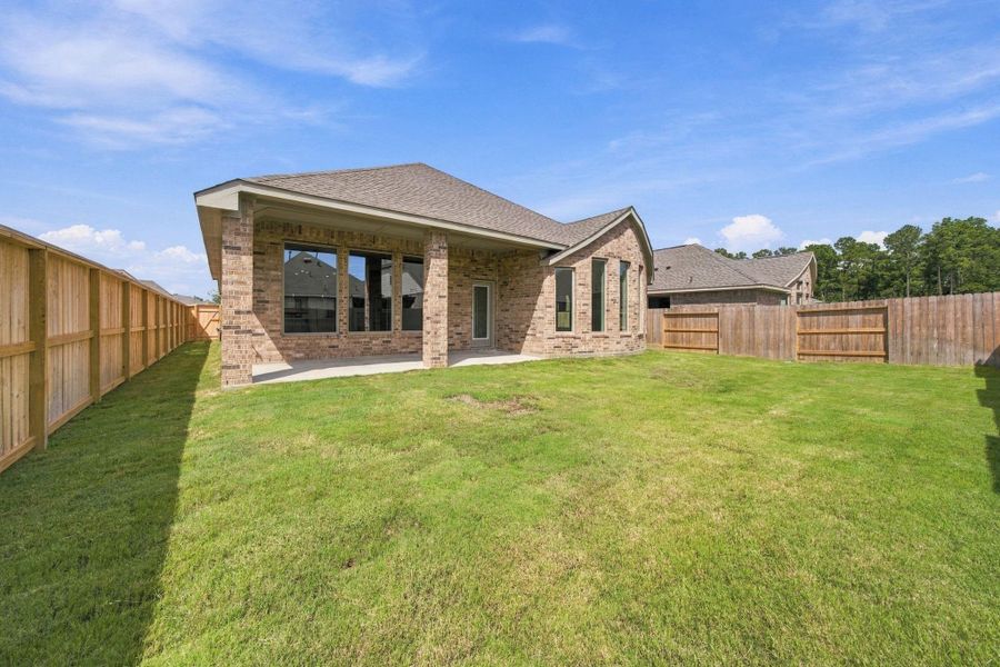 Exterior details and patio area of a home in The Trails, New Caney (Image 4). Exterior details and patio area of a home in The Trails, New Caney (Image 4).