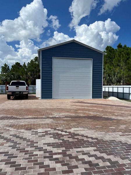 Front exterior of a new home in , Palm Bay, FL, highlighting curb appeal (Image 1).