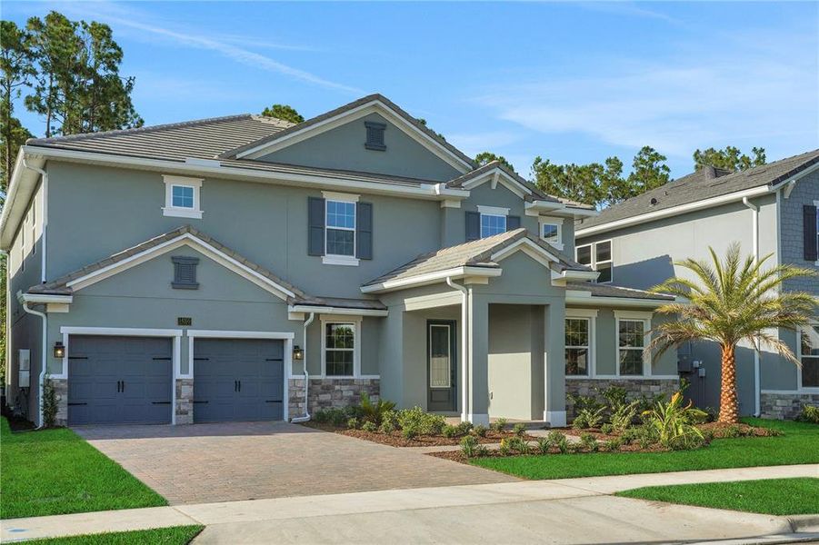Front exterior of a new home in Palms at Windermere, Windermere, FL, highlighting curb appeal (Image 1). Front exterior of a new home in Palms at Windermere, Windermere, FL, highlighting curb appeal (Image 1).