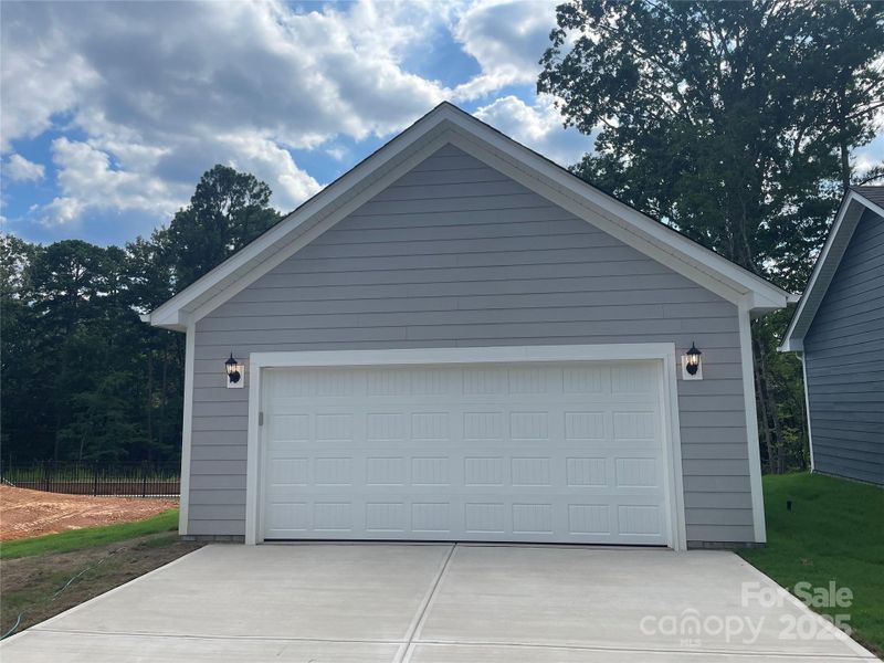 Rear, Detached, 2 Car Garage backs to trees and walking trail