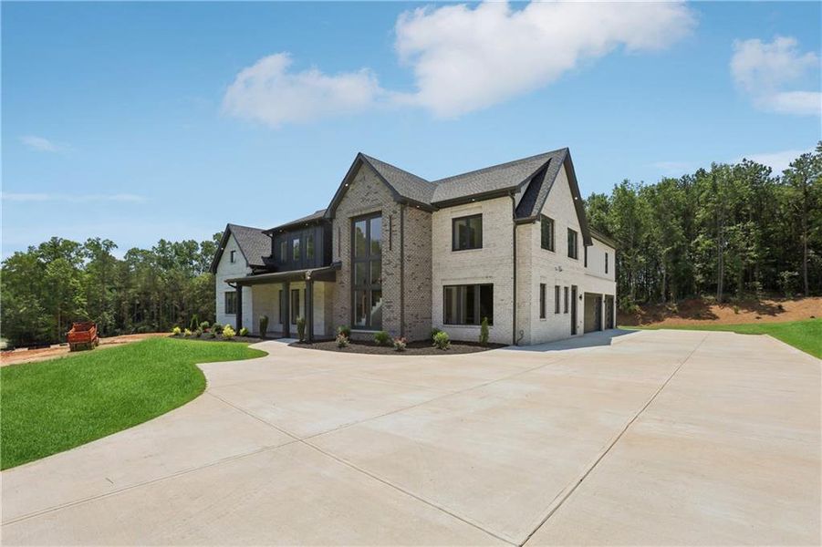 Front exterior of a new home in , Braselton, GA, highlighting curb appeal (Image 36).