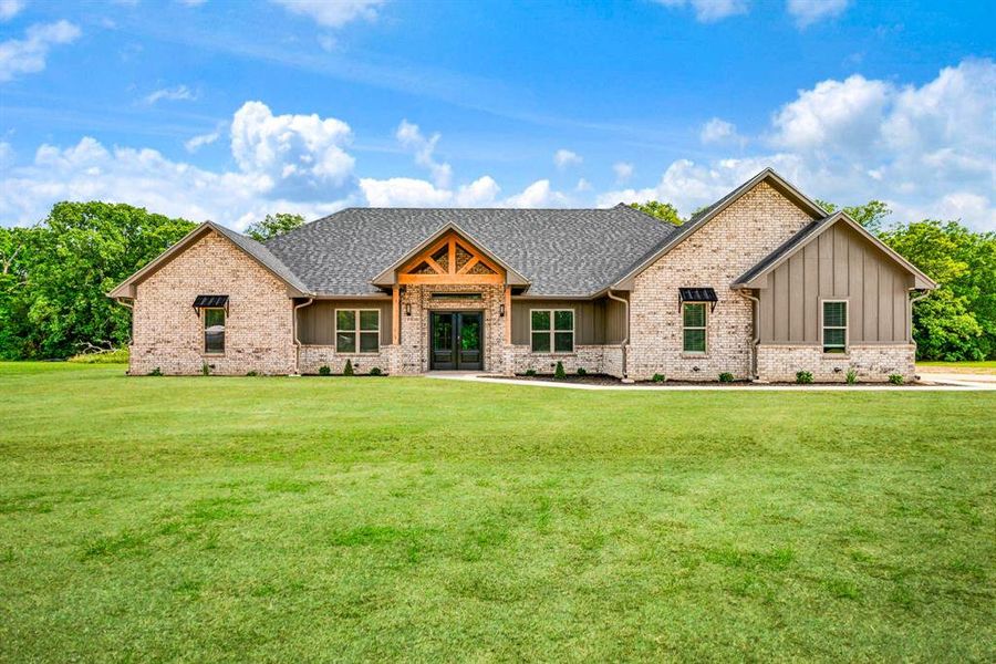 Front exterior of a new home in , Blossom, TX, highlighting curb appeal (Image 1). Front exterior of a new home in , Blossom, TX, highlighting curb appeal (Image 1).