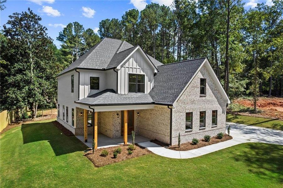 Front exterior of a new home in , Winder, GA, highlighting curb appeal (Image 25). Front exterior of a new home in , Winder, GA, highlighting curb appeal (Image 25).