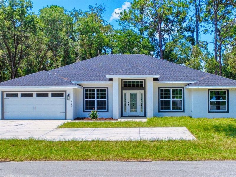Front exterior of a new home in , Inverness, FL, highlighting curb appeal (Image 26).