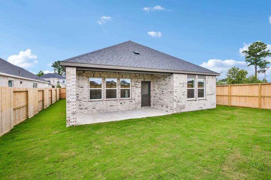 Exterior details and patio area of a home in Raburn Reserve 50s, Tomball (Image 4).