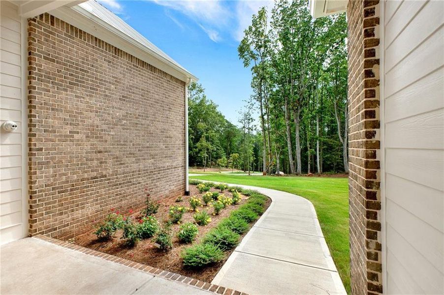 Front exterior of a new home in , Canton, GA, highlighting curb appeal (Image 37).