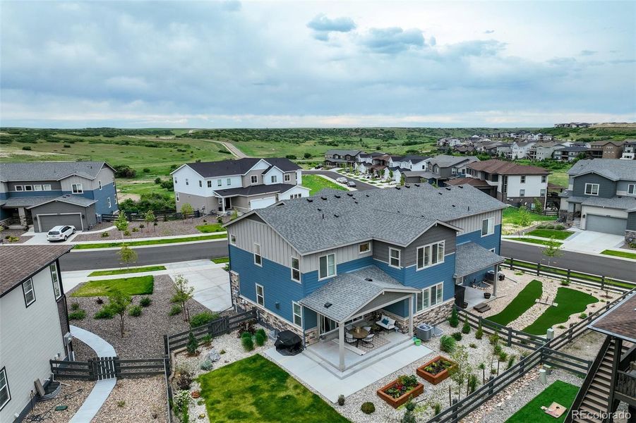 Front exterior of a new home in , Castle Pines, CO, highlighting curb appeal (Image 22). Front exterior of a new home in , Castle Pines, CO, highlighting curb appeal (Image 22).