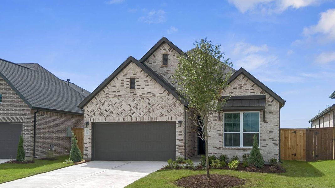 Front exterior of a new home in Brookewater, Rosenberg, TX, highlighting curb appeal (Image 15).