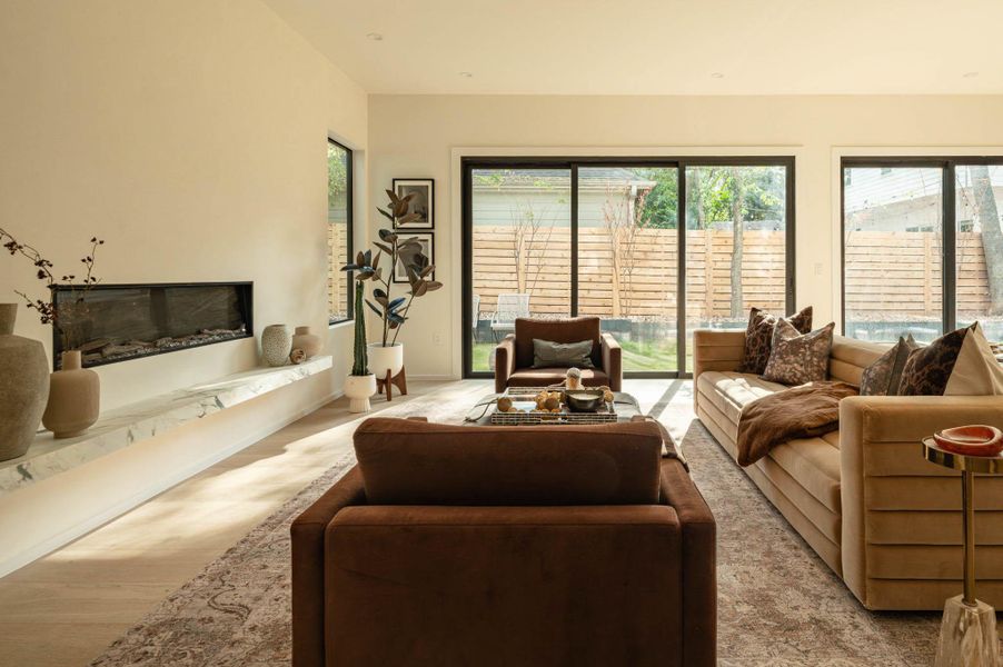 Living area with large sliding doors to let tons of natural lights in