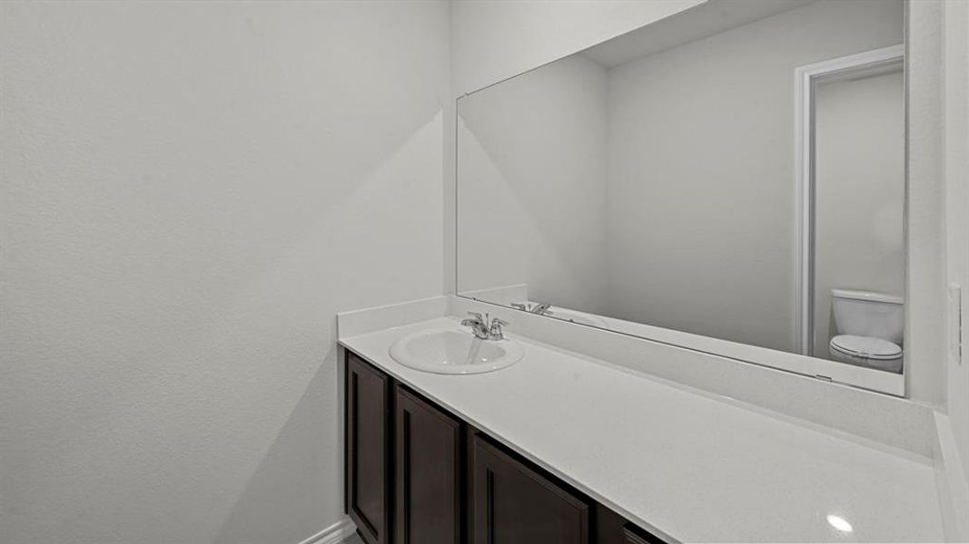 Bathroom featuring toilet and vanity