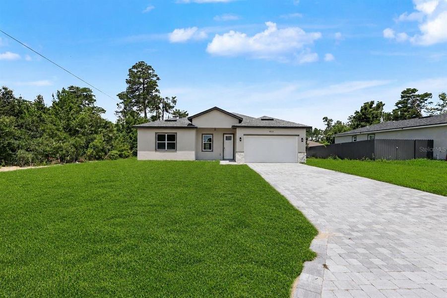 Front exterior of a new home in , Ocala, FL, highlighting curb appeal (Image 25).
