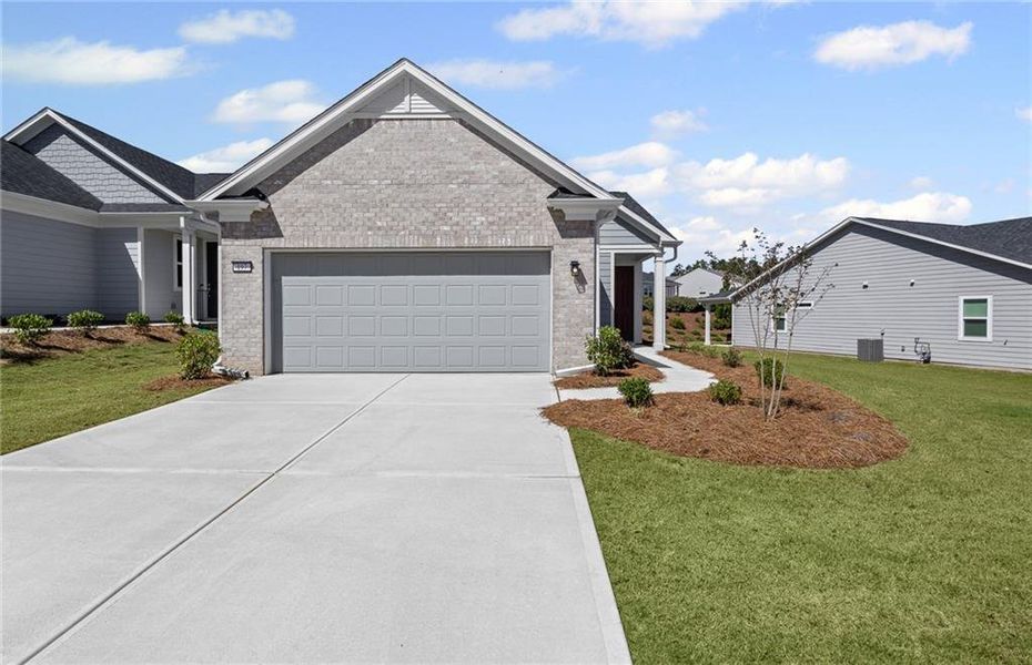 Front exterior of a new home in Sun City Peachtree, Griffin, GA, highlighting curb appeal (Image 2). Front exterior of a new home in Sun City Peachtree, Griffin, GA, highlighting curb appeal (Image 2).