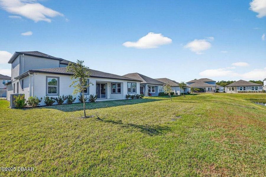 Exterior details and patio area of a home in Legends Preserve - Reserve Series, Daytona Beach (Image 3). Exterior details and patio area of a home in Legends Preserve - Reserve Series, Daytona Beach (Image 3).