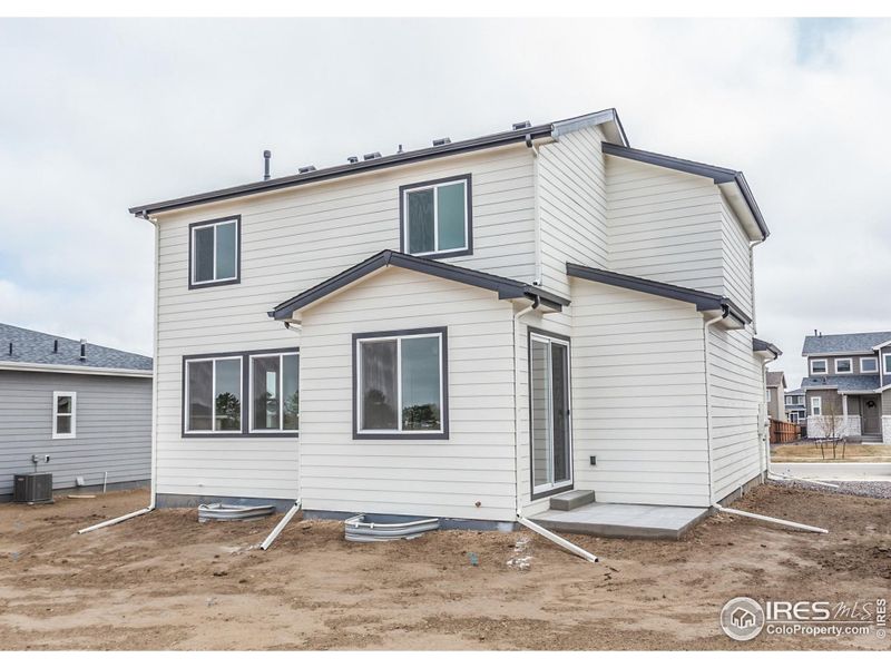Front exterior of a new home in Promontory Point, Greeley, CO, highlighting curb appeal (Image 2). Front exterior of a new home in Promontory Point, Greeley, CO, highlighting curb appeal (Image 2).