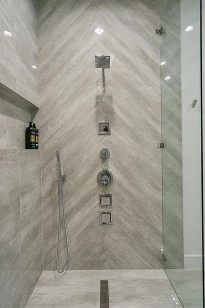 Bathroom featuring a tile shower Bathroom featuring a tile shower