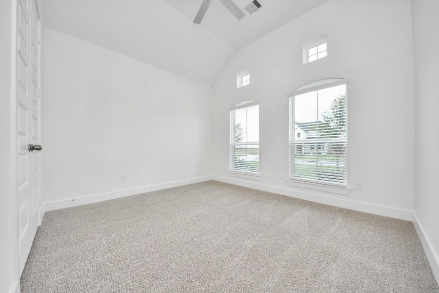 Generously sized secondary bedrooms featuring spacious closets, soft and inviting carpeting underfoot, large windows allowing plenty of natural light, and the added touch of privacy blinds for your personal retreat.