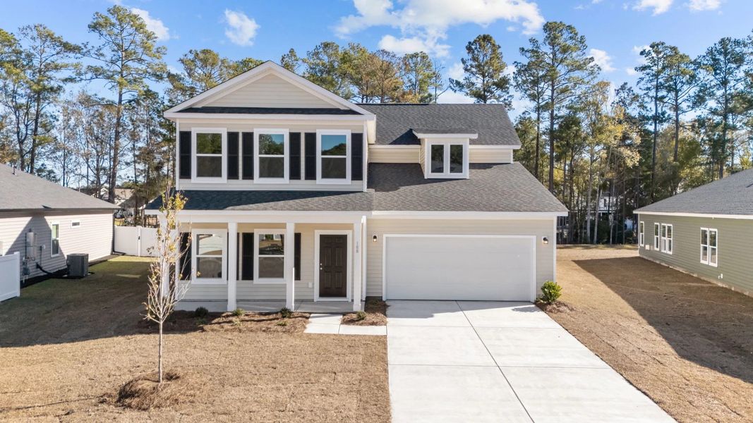 Front exterior of a new home in Trieste at Bella Vita, Myrtle Beach, SC, highlighting curb appeal (Image 1). Front exterior of a new home in Trieste at Bella Vita, Myrtle Beach, SC, highlighting curb appeal (Image 1).