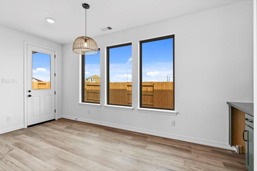 Light-filled dining room connected to the kitchen, perfect for relaxed meals and entertaining.