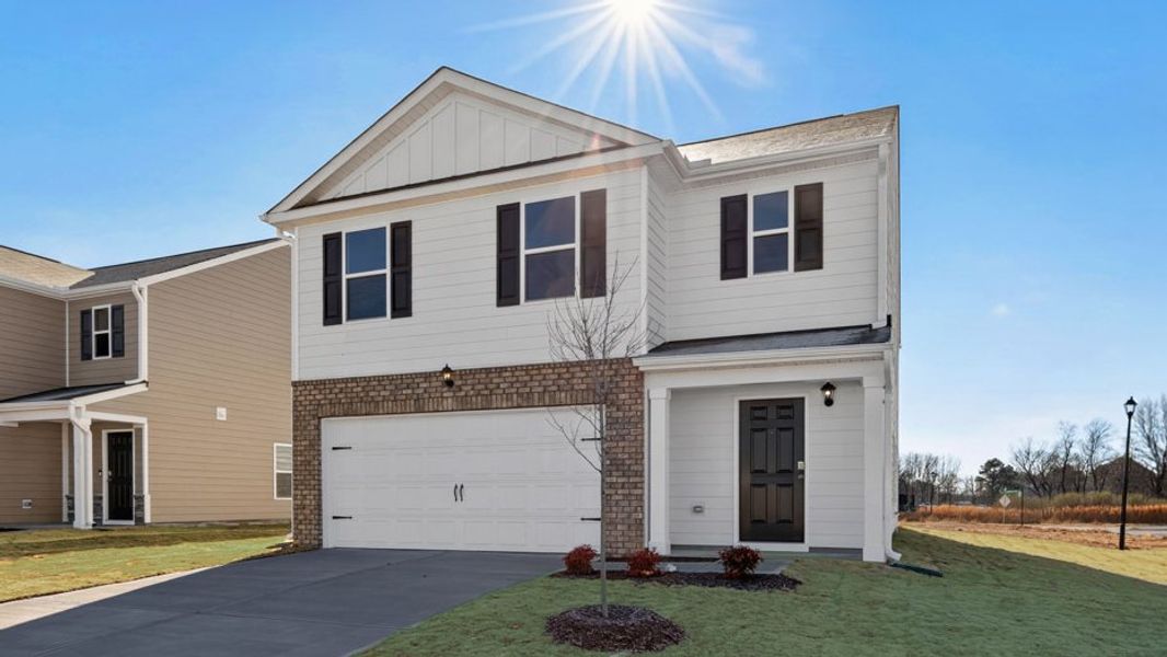 Front exterior of a new home in Carter Ridge, Greenville, NC, highlighting curb appeal (Image 16). Front exterior of a new home in Carter Ridge, Greenville, NC, highlighting curb appeal (Image 16).
