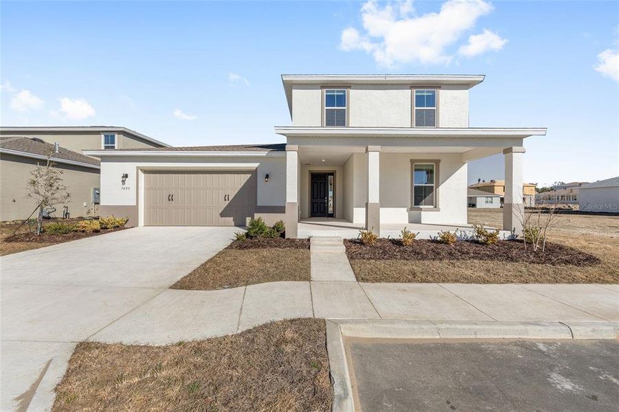 Front exterior of a new home in Calesa Township, Ocala, FL, highlighting curb appeal (Image 24).