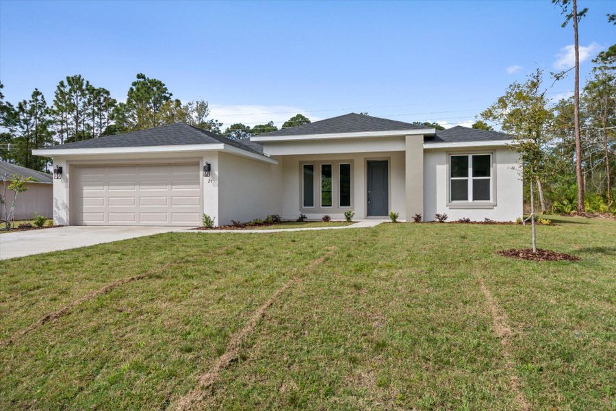 Front exterior of a new home in , Palm Coast, FL, highlighting curb appeal (Image 16).