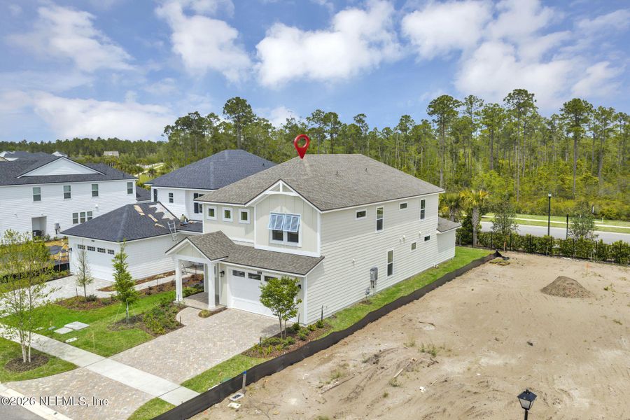 Front exterior of a new home in Seabrook Village at Seabrook, Ponte Vedra, FL, highlighting curb appeal (Image 27). Front exterior of a new home in Seabrook Village at Seabrook, Ponte Vedra, FL, highlighting curb appeal (Image 27).