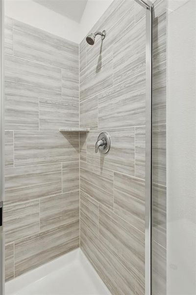 Full bathroom with a shower stall