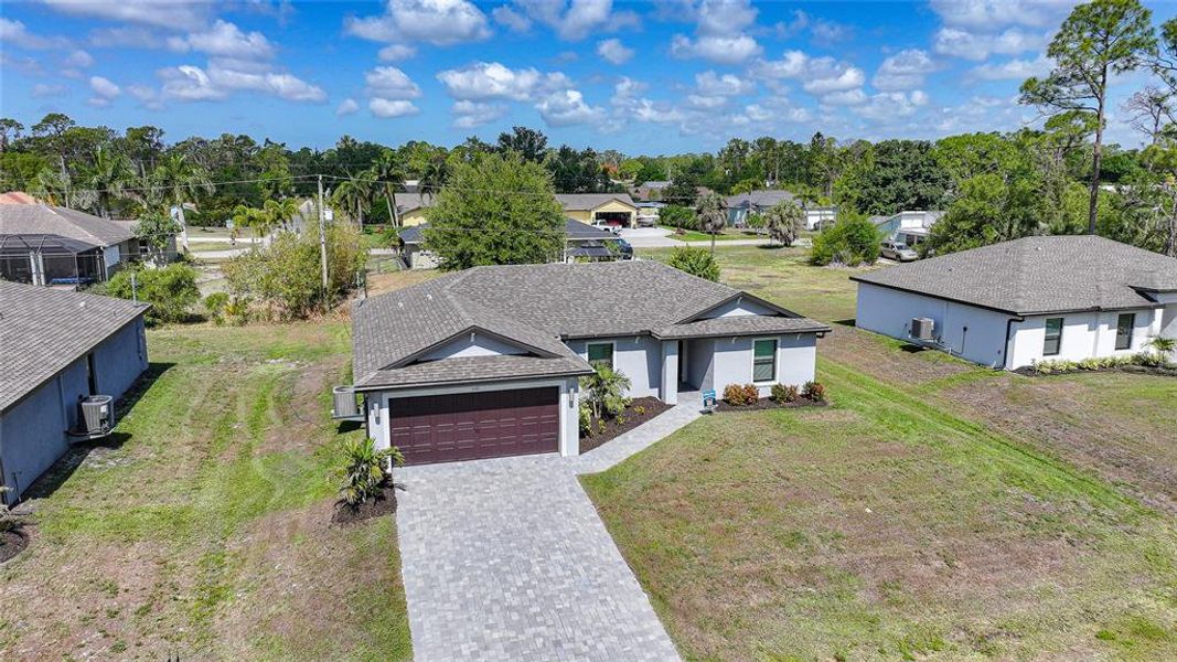 Front exterior of a new home in , Port Charlotte, FL, highlighting curb appeal (Image 24).