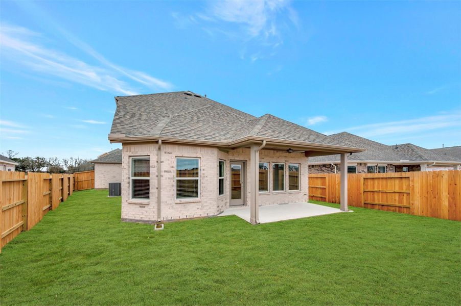Exterior details and patio area of a home in Wildrye, Waller (Image 24).