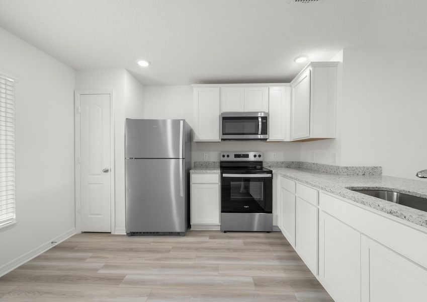 A spacious kitchen perfect for cooking family meals. A spacious kitchen perfect for cooking family meals.