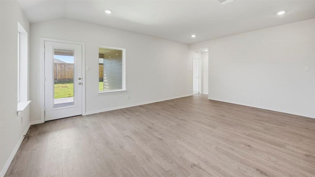 Spare room with light wood-style flooring and recessed lighting Spare room with light wood-style flooring and recessed lighting