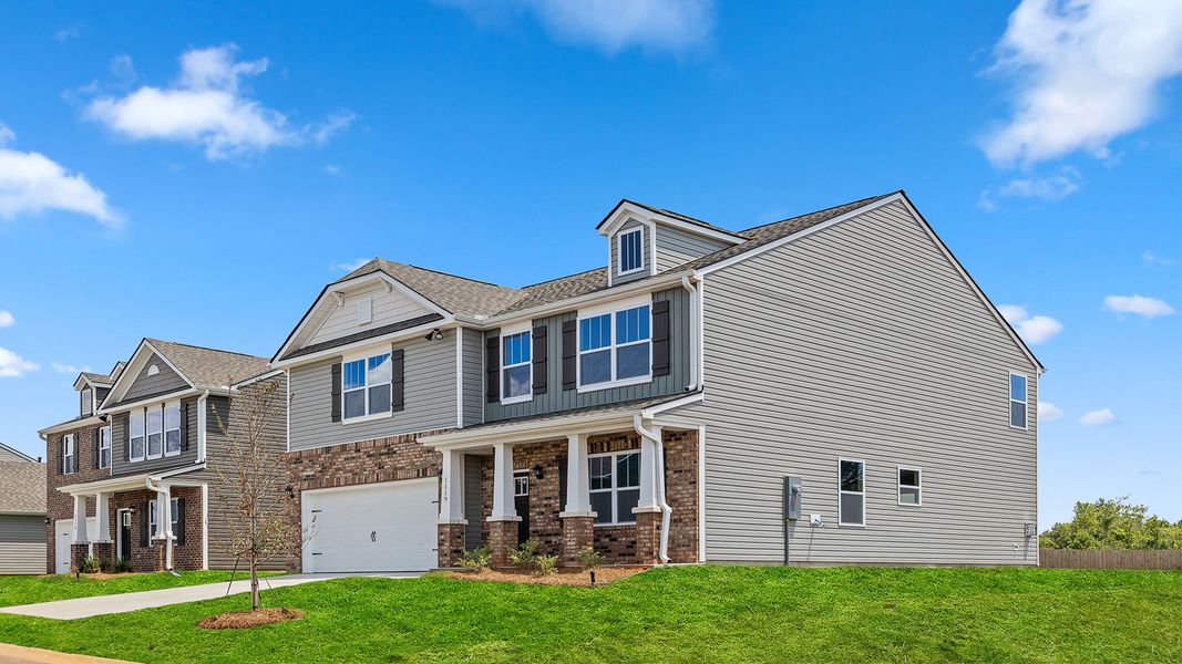 Front exterior of a new home in Chestnut Ridge, Greenville, SC, highlighting curb appeal (Image 20). Front exterior of a new home in Chestnut Ridge, Greenville, SC, highlighting curb appeal (Image 20).