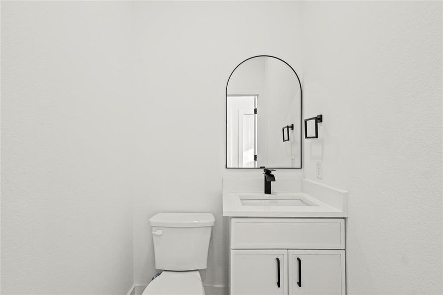 Bathroom featuring toilet and vanity