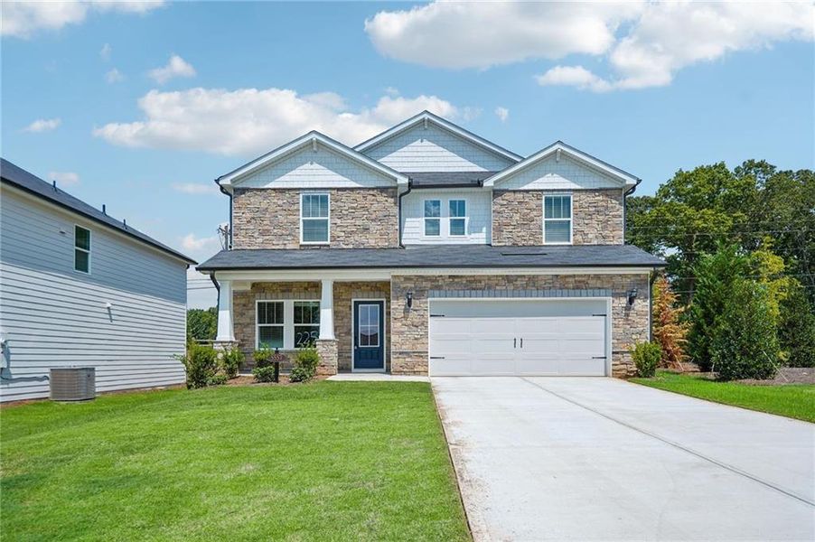 Front exterior of a new home in Vines at Mill Creek - Estate Series, Braselton, GA, highlighting curb appeal (Image 2). Front exterior of a new home in Vines at Mill Creek - Estate Series, Braselton, GA, highlighting curb appeal (Image 2).