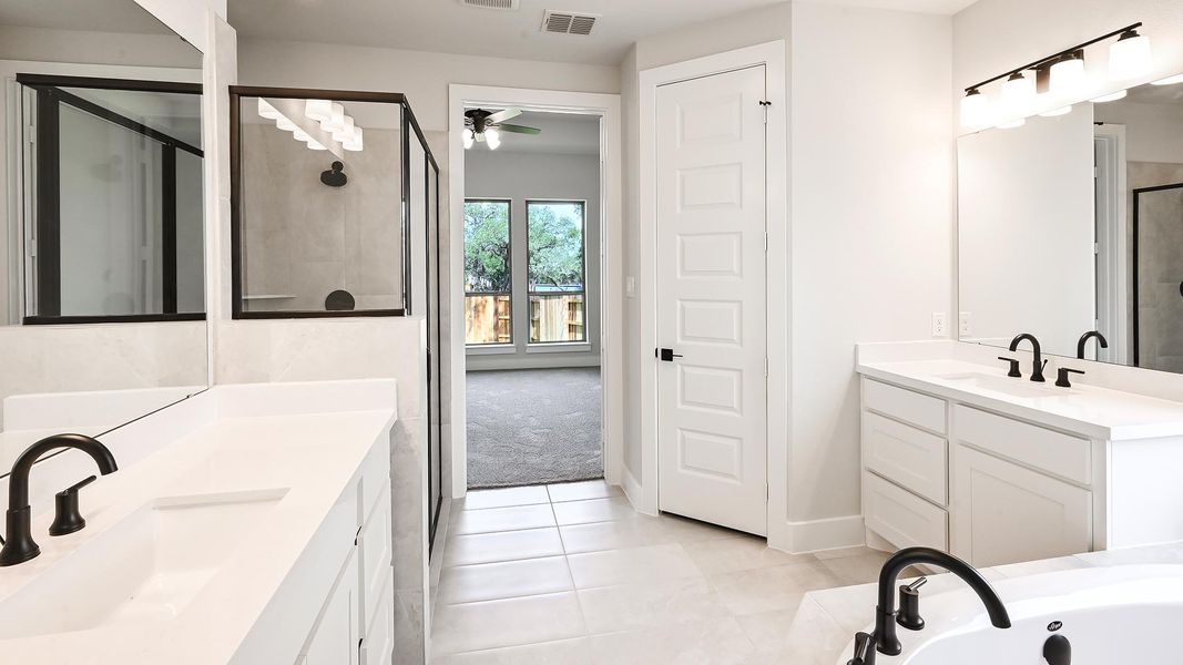 Furnished interior view inside a new home in 6 Creeks 50', Kyle (Image 12).