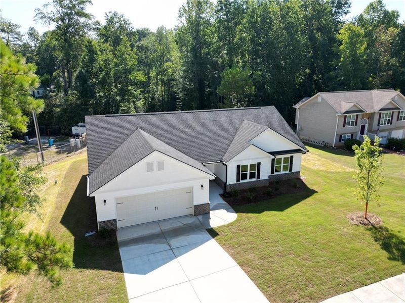 Front exterior of a new home in , Temple, GA, highlighting curb appeal (Image 1). Front exterior of a new home in , Temple, GA, highlighting curb appeal (Image 1).