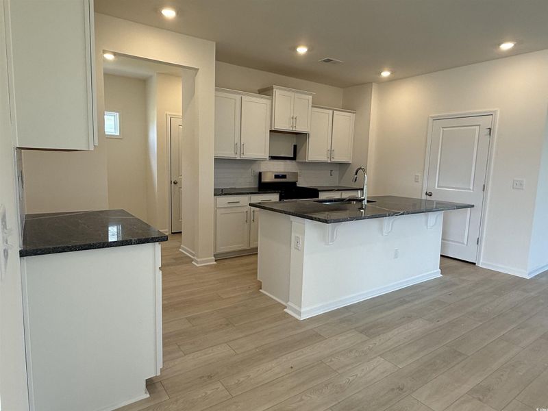 Spare room featuring ornamental molding and light wood-type flooring Spare room featuring ornamental molding and light wood-type flooring