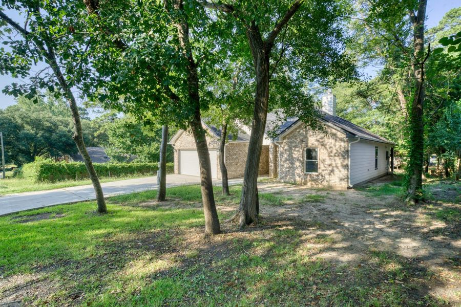 Front exterior of a new home in , Huntsville, TX, highlighting curb appeal (Image 1). Front exterior of a new home in , Huntsville, TX, highlighting curb appeal (Image 1).