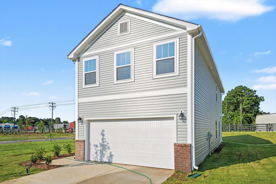 Front exterior of a new home in Masons Mill, Erwin, NC, highlighting curb appeal (Image 2).