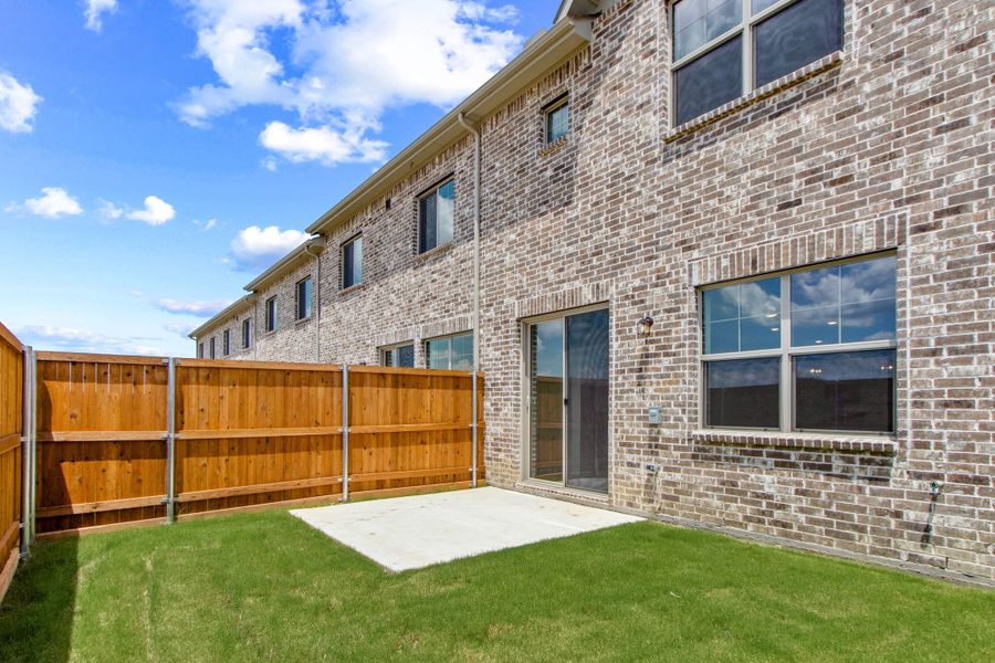 Exterior details and patio area of a home in Wildridge, Oak Point (Image 4).