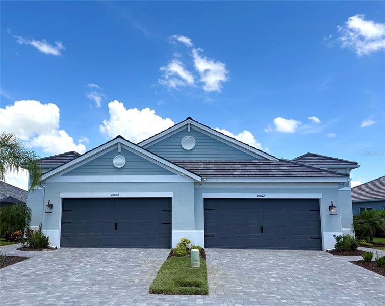 Front exterior of a new home in , Sarasota, FL, highlighting curb appeal (Image 2). Front exterior of a new home in , Sarasota, FL, highlighting curb appeal (Image 2).