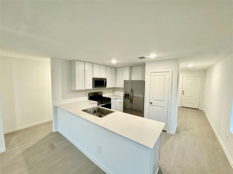 Furnished interior view inside a new home in Pinewood at Grand Texas, New Caney (Image 6).