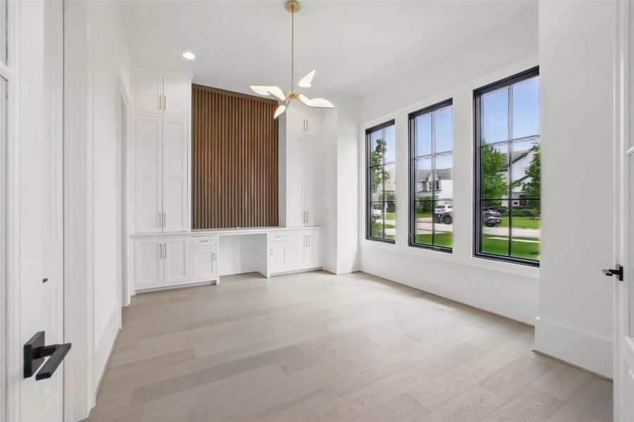 Sample of builder's previous construction. This home will have a downstairs study with a wall of built-ins This room is adjacent to a full bath & has a closet, so this could make an optional 6th bedroom, if needed. Buyer still has time to select finishes.