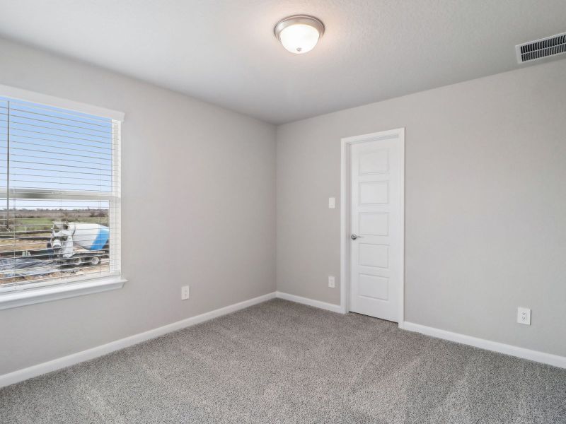 Guest bedroom in the Medina floorplan at a Meritage Homes community. Guest bedroom in the Medina floorplan at a Meritage Homes community.
